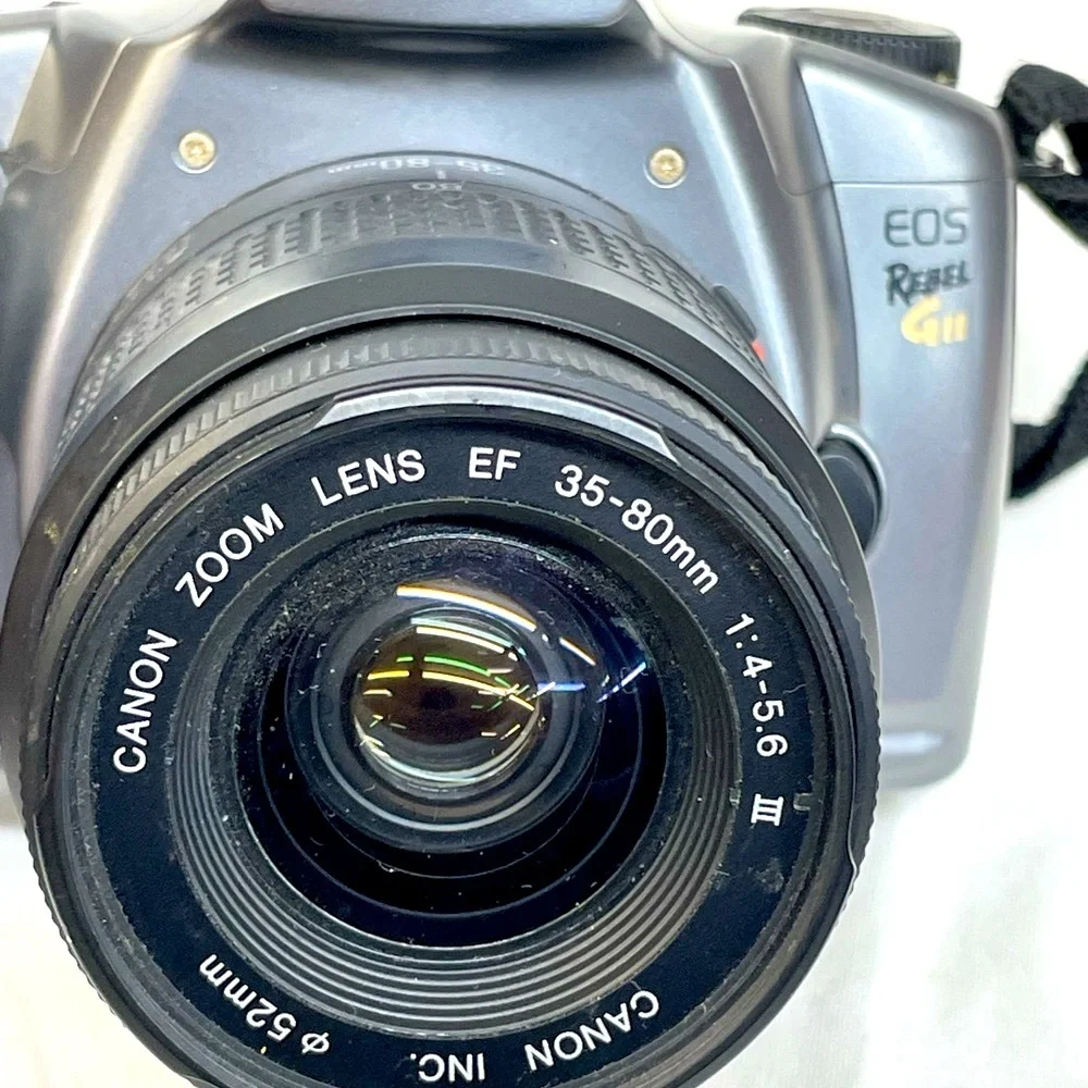 Canon EOS Rebel GII 35mm SLR Camera - Silver & Black with shoulder strap